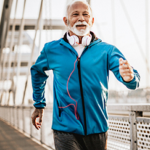 Older man speed walking on a bridge
