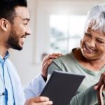 Doctor consulting with an older female patient